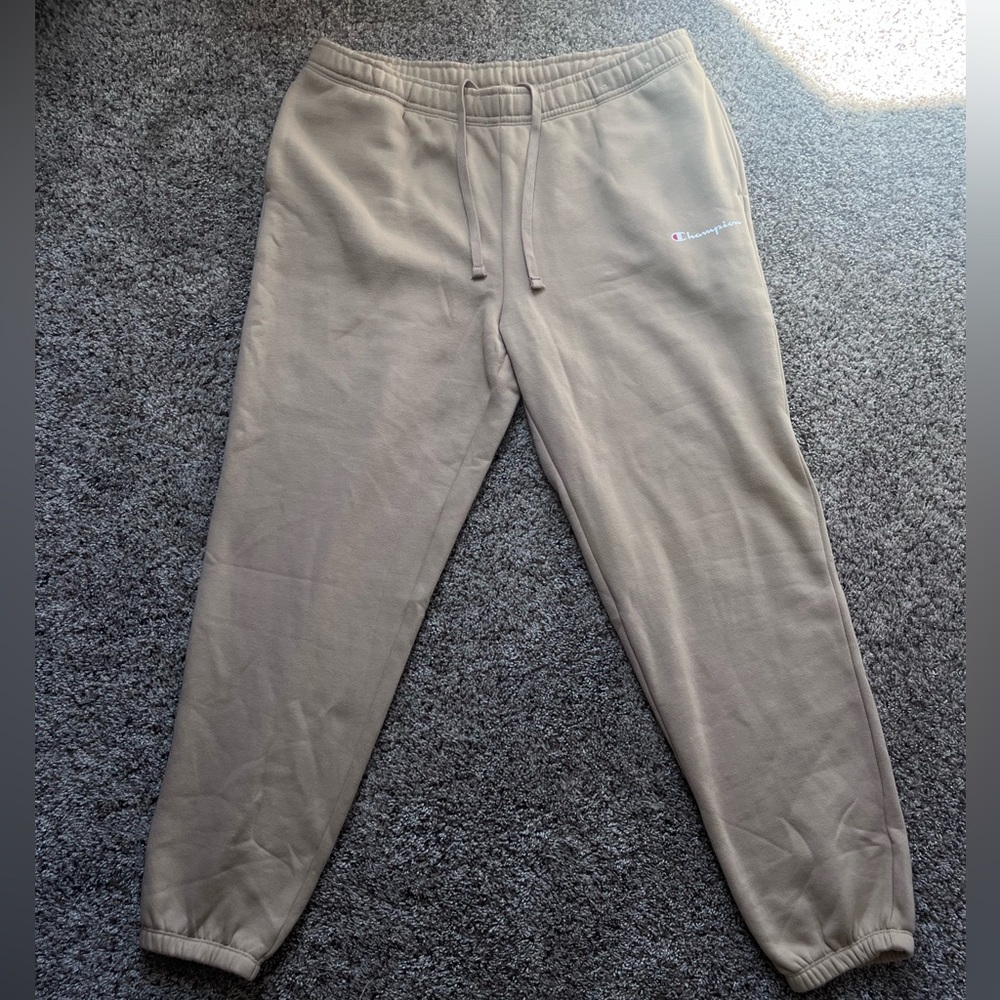Large cream colored champion sweatpants.